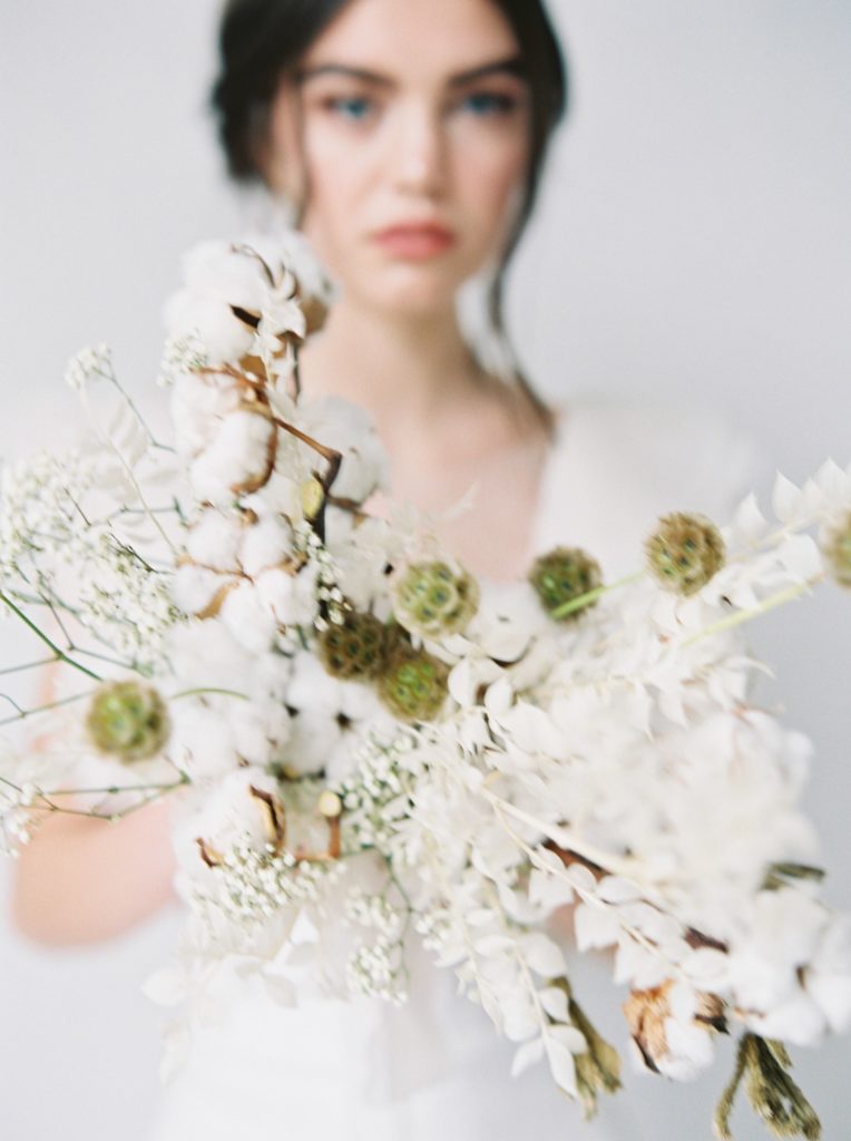 Wedding event planner Vancouver ethereal wedding bride holding cottonball bouquet 