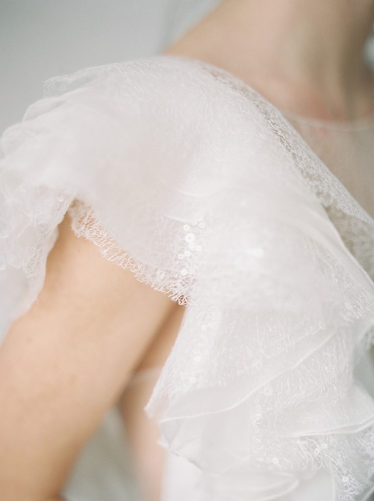 Wedding event planner Vancouver ethereal wedding with Rime Arodaky dress with ruffle sleeves