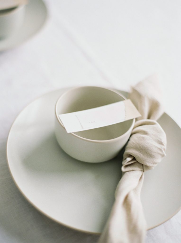Wedding event planner Vancouver ethereal wedding simple place setting with ceramic plates and bowls