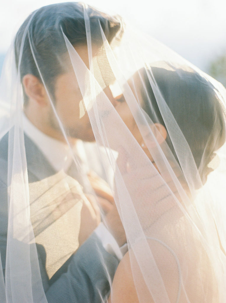 Wedding Event Planner Vancouver Sea to Sky romantic sunset veil kiss