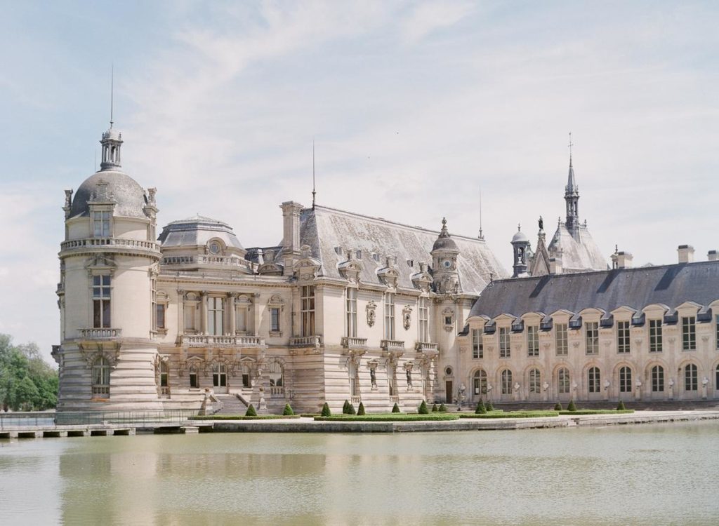 Romantic and Luxurious Wedding Venue Chateau De Chantilly stunning building with water surrounding