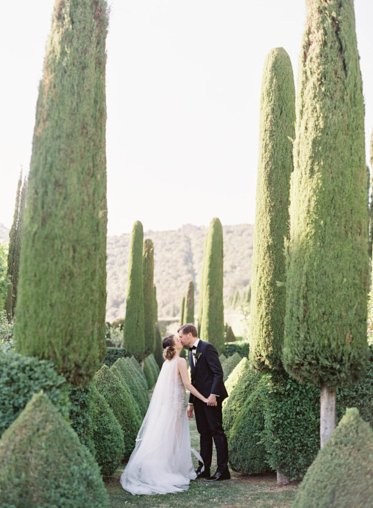 Destination Wedding Planner Villa Cetinale bride and groom walking in garden
