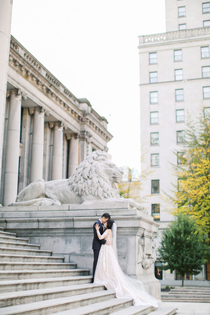 wedding couple posing in downtown Vancouver