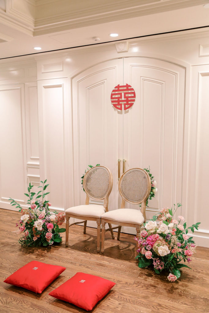 wedding tea ceremony decor with pillows and flowers