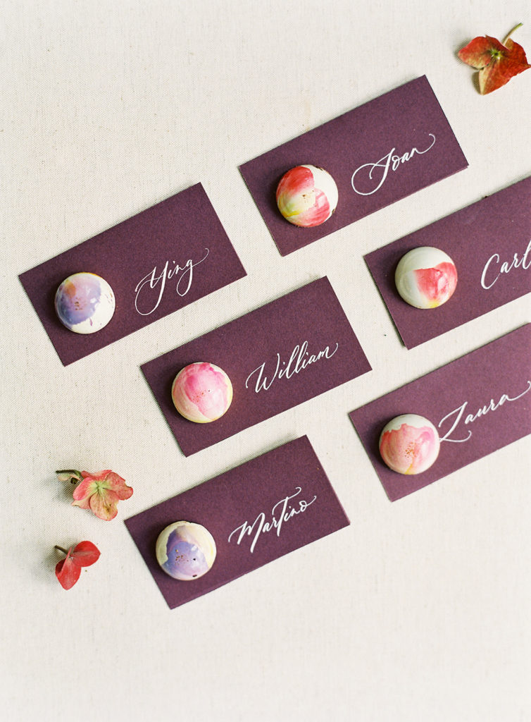 Purple place cards in calligraphy