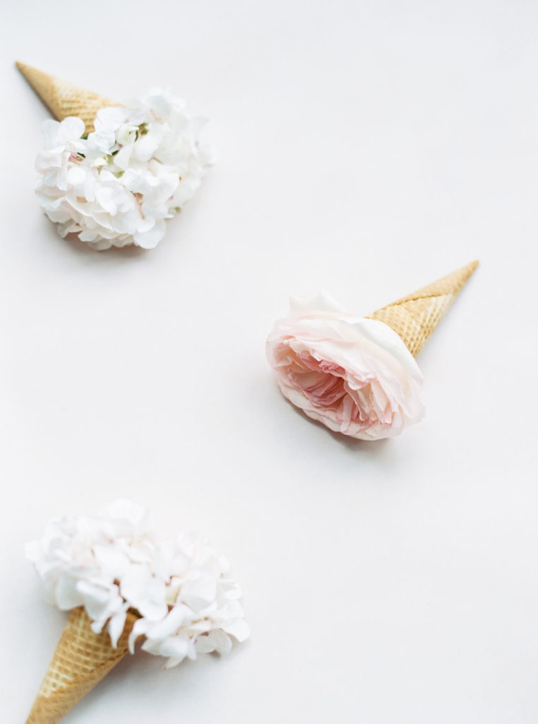 three floral filled ice cream cones