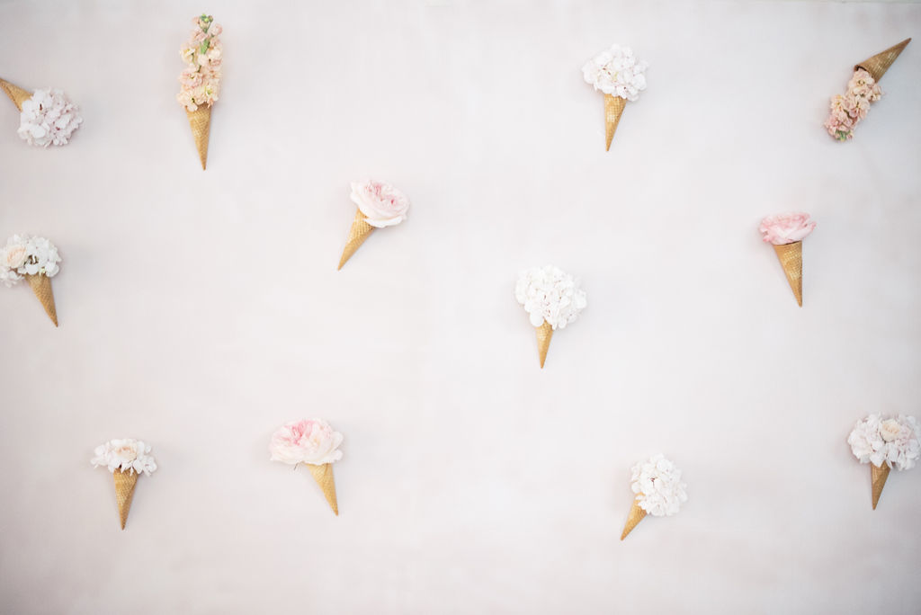 ice cream and florals on pink backdrop