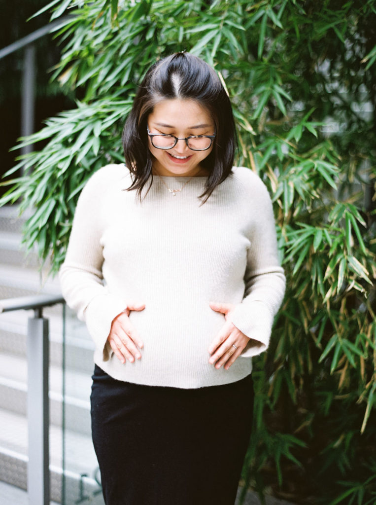 vancouver mother to be with hands on tummy