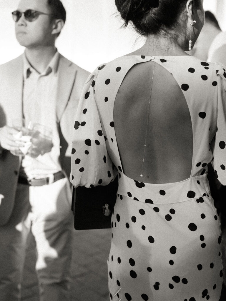 Wedding guests in suit and polka dot dress