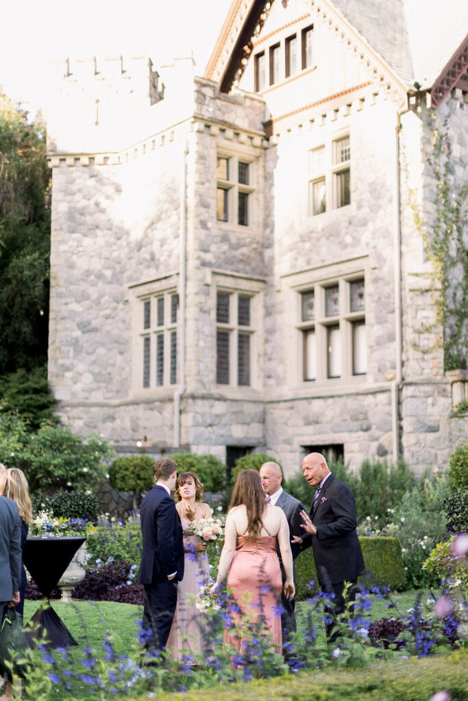 Wedding guests in formal attire at cocktail hour