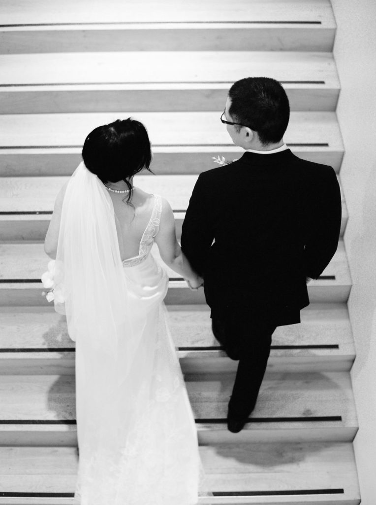 Black and white picture of couple walking up stairs