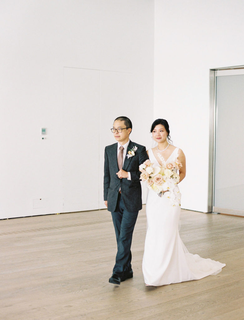 Bride walking down the aisle at polygon gallery