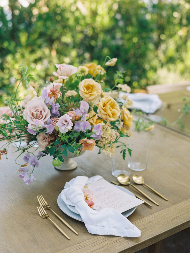 closeup of reception place setting with florals
