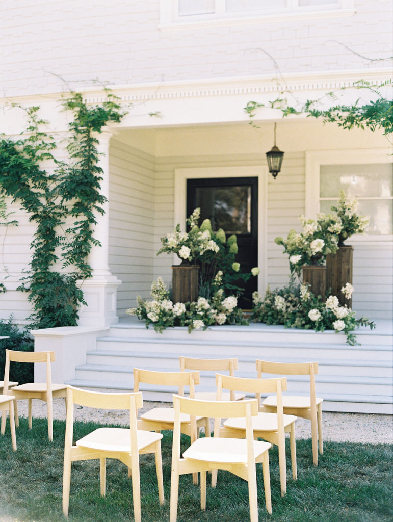 Green and white floral wedding ceremony
