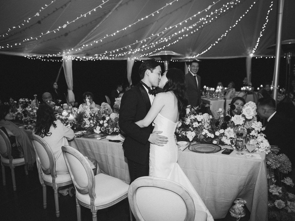 newlyweds kiss at reception
