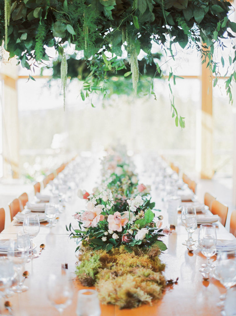 hanging greenery install at reception table
