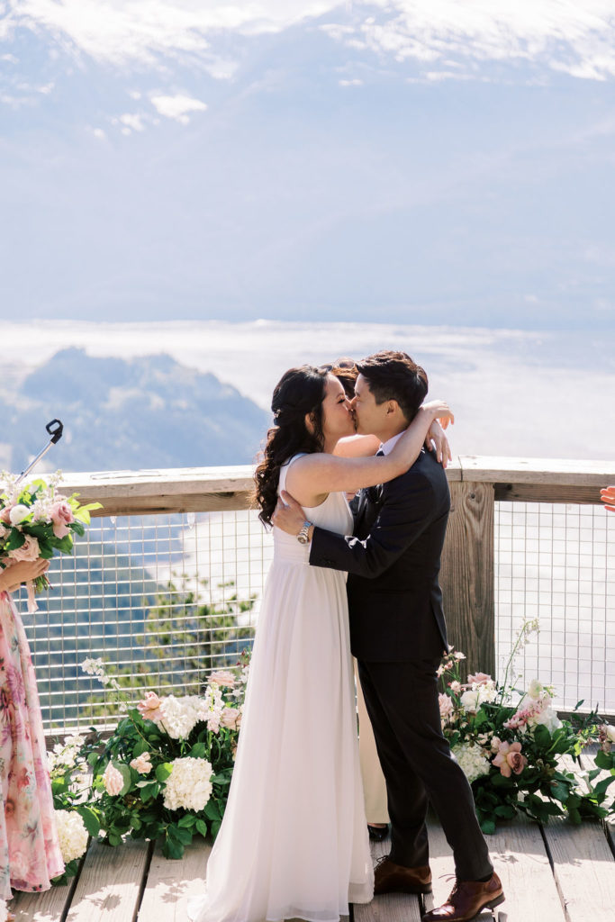 newlyweds share a kiss at ceremony