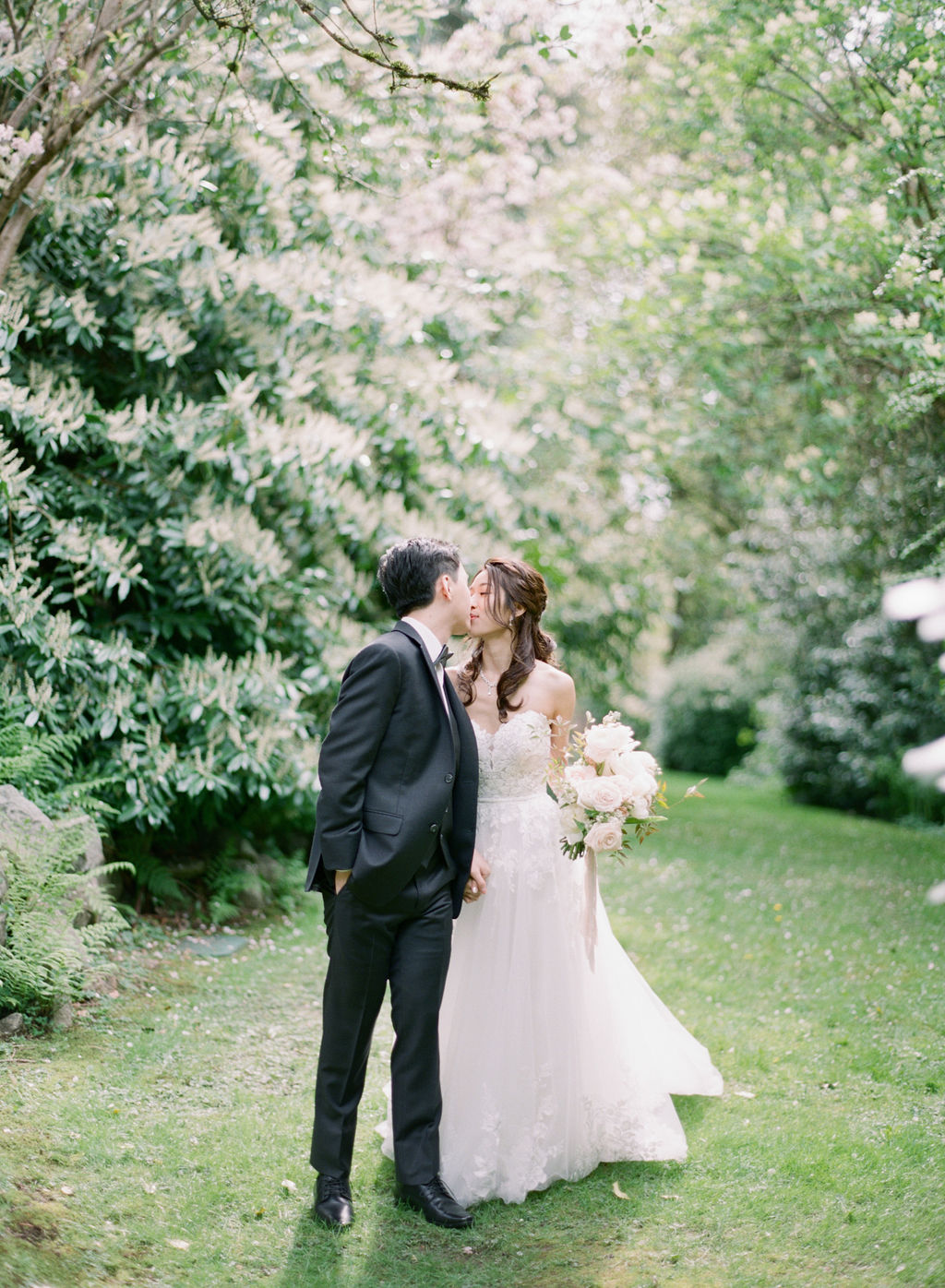 bride and groom kiss portrait