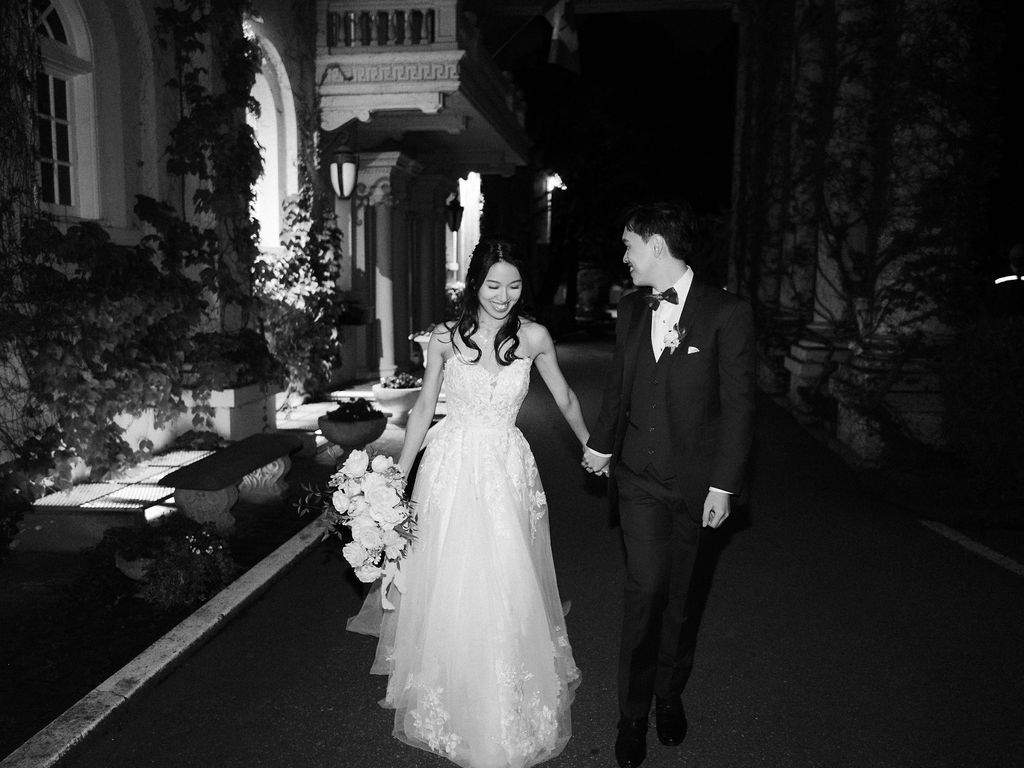 bride and groom stroll in evening