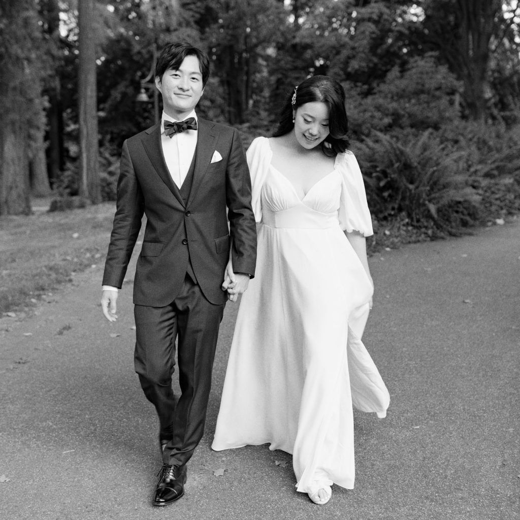 black and white photo of couple strolling