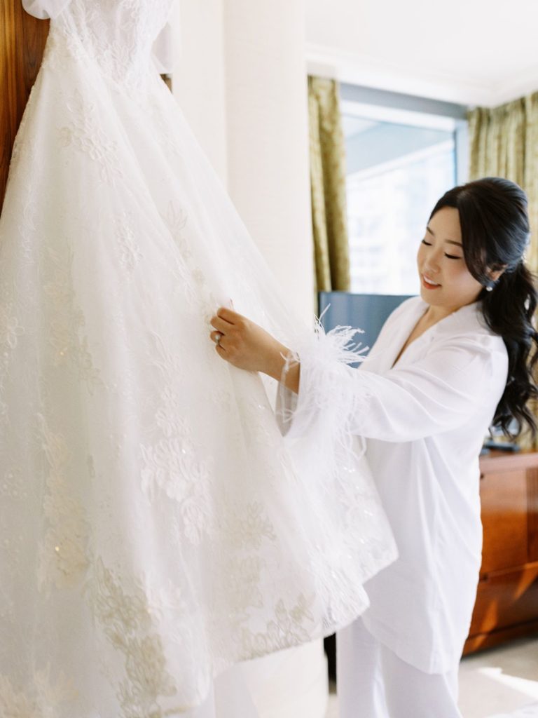 bride fixing wedding dress