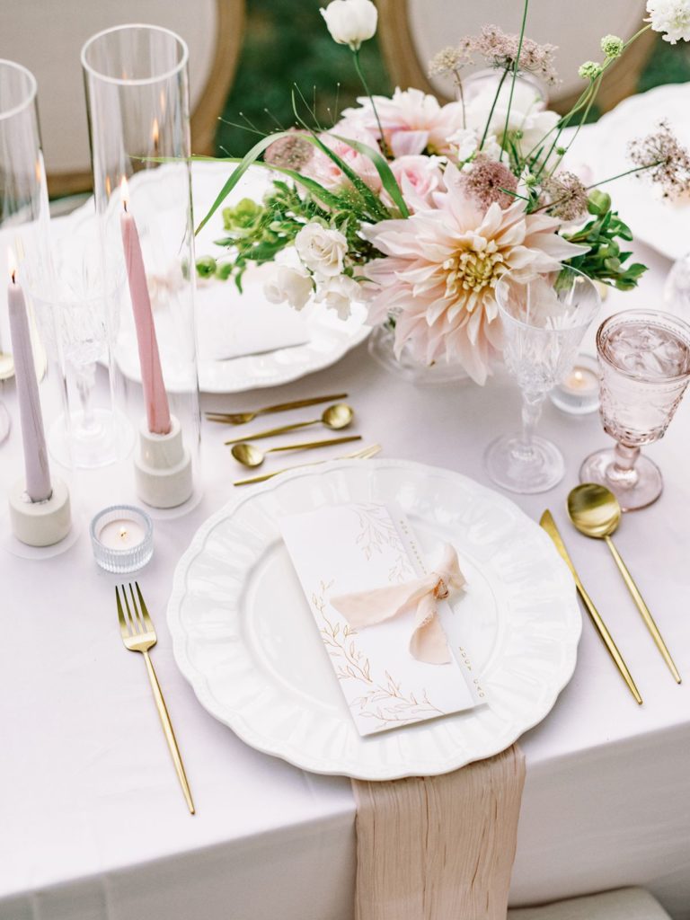 closeup of luxury tablescape under tent