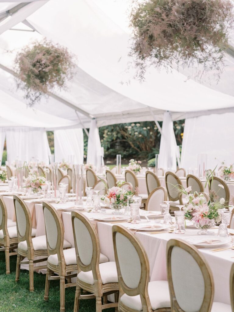 Chairs and tables lined under frame tent