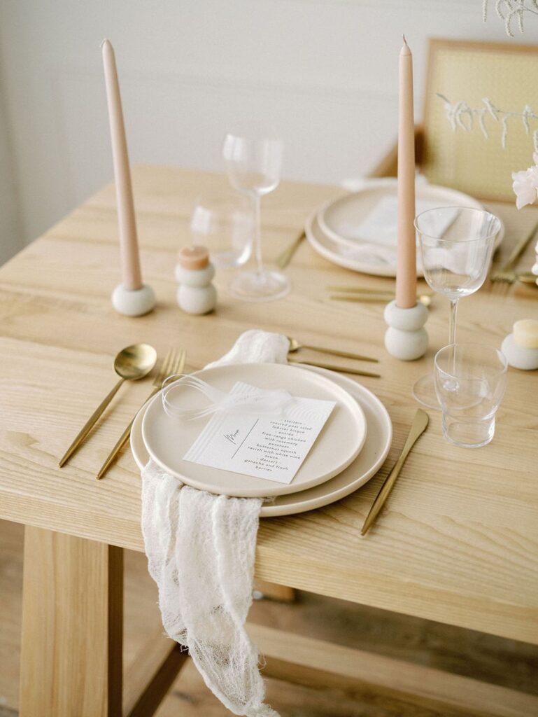 dinner place setting with gold flatware