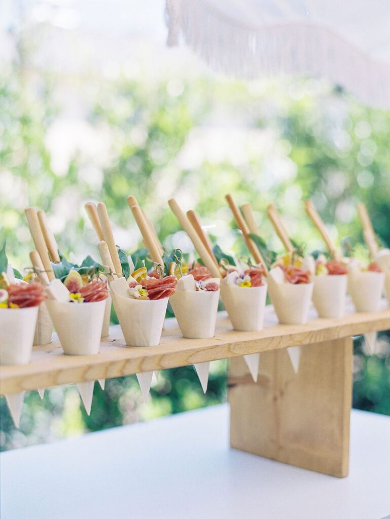 canapes in cones on wooden stand