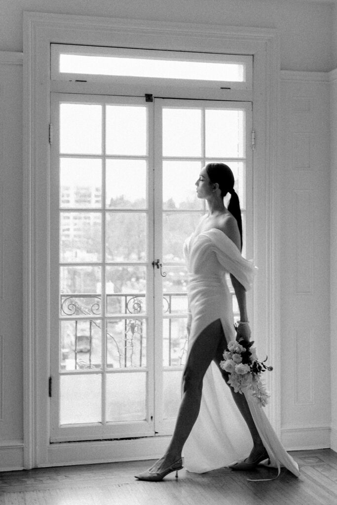 black and white photo of bride walking