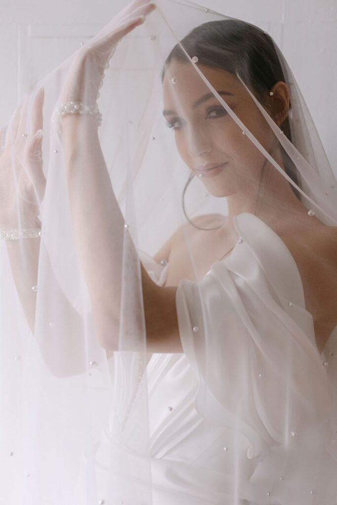 bride smiling under veil