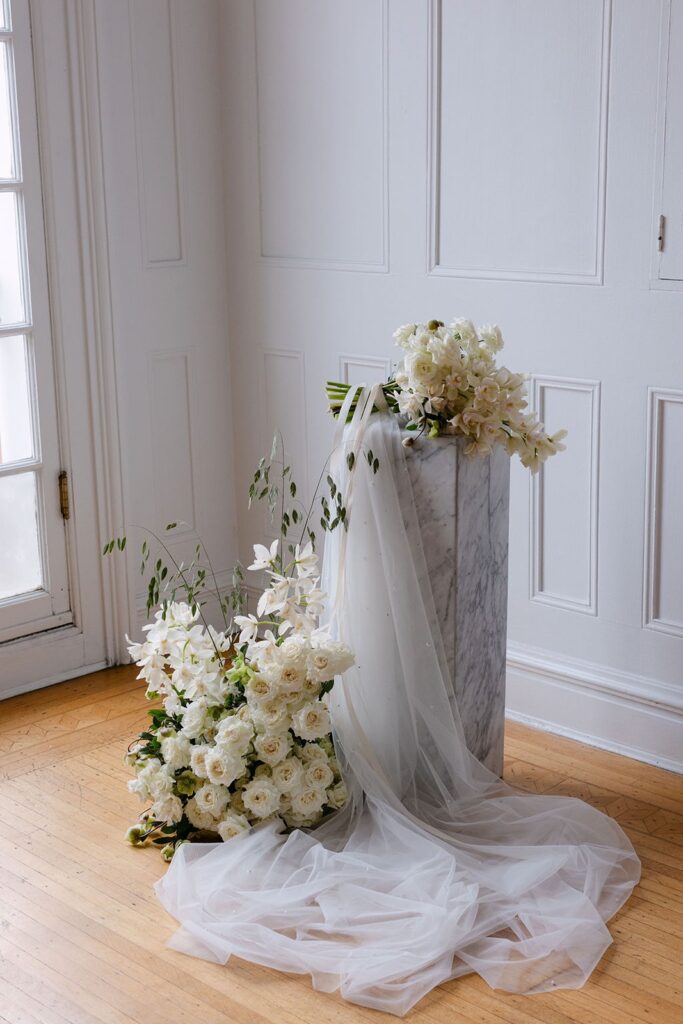 white modern flower arrangement with marble