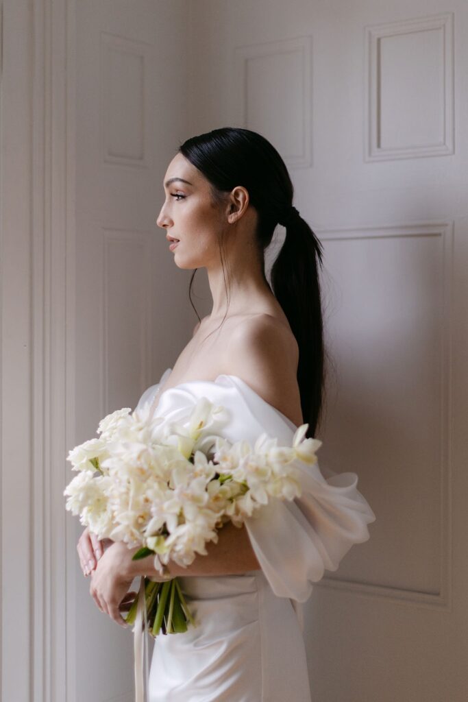 bride in low sleek ponytail side profile