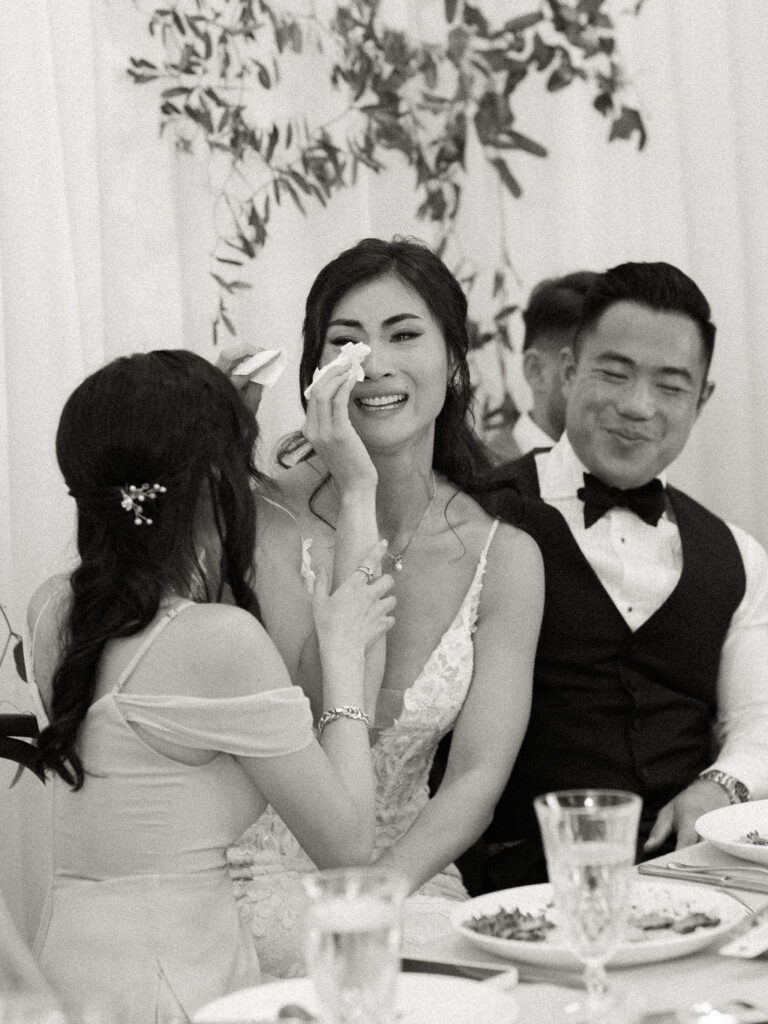 bride tearing up at reception