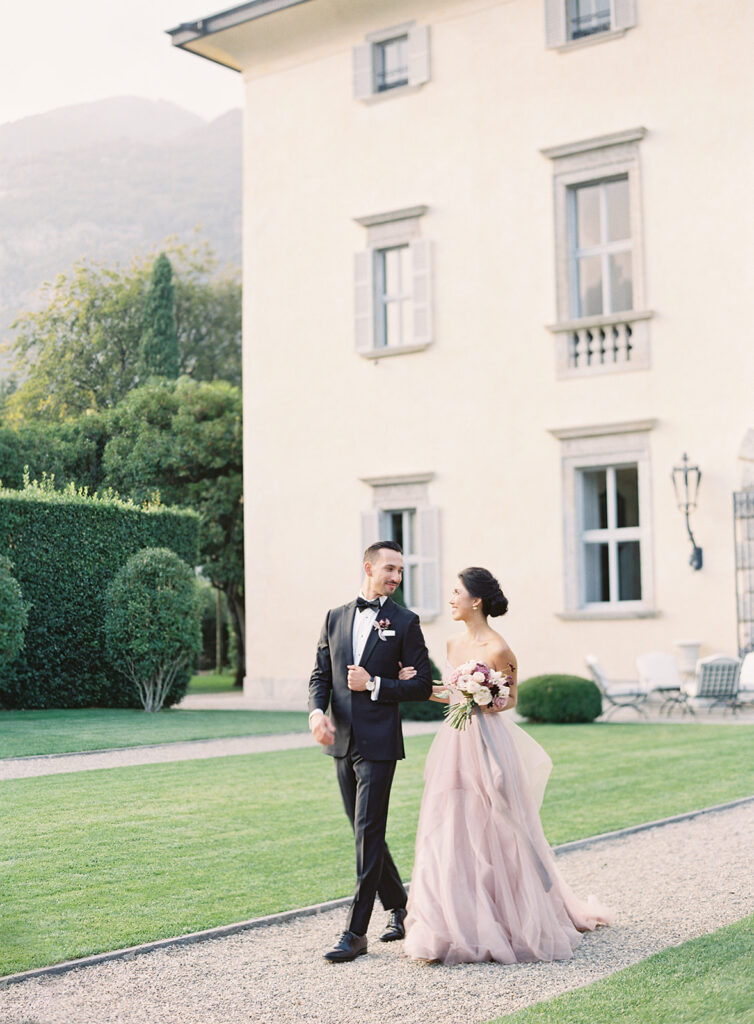 Bride and groom strolling at Italy wedding venue