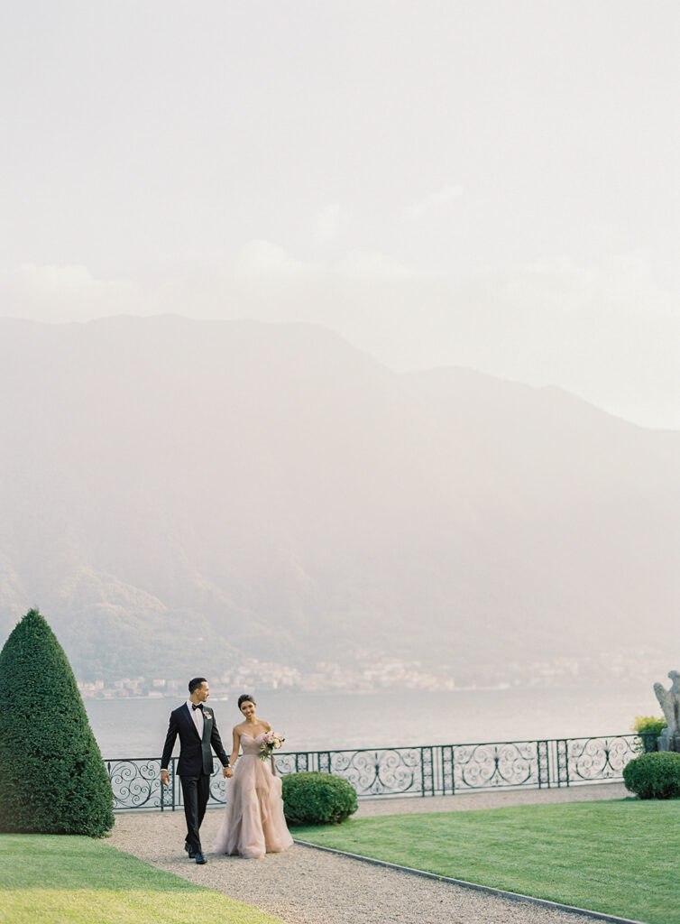 Couple walking with Lake Como backdrop