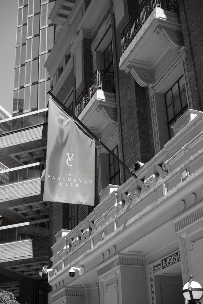 Vancouver Club flag with building backdrop