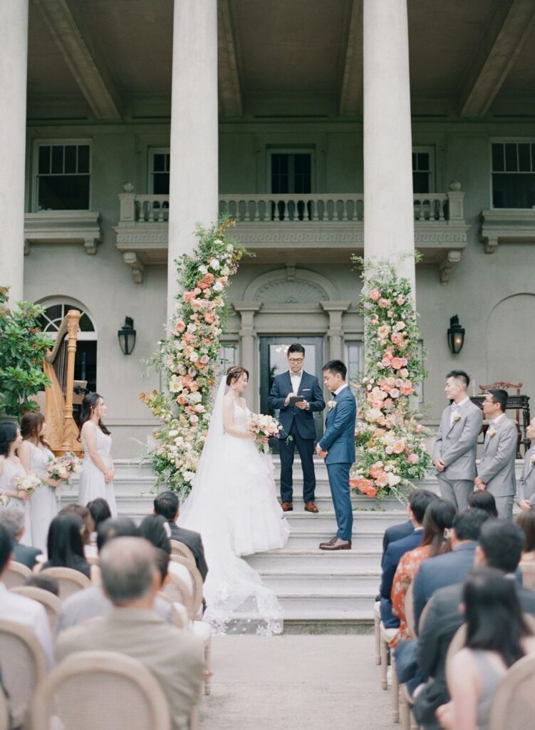couple standing on other side of beams